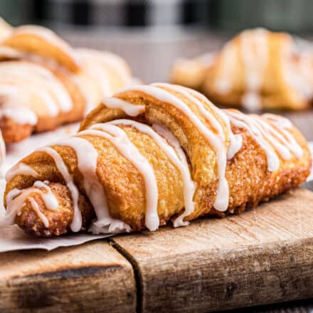 cinnamon crescent rolls on wooden cutting board