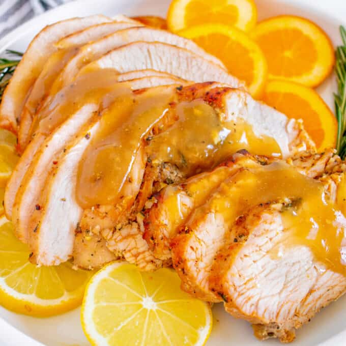 slices of turkey breast on top of sliced citrus and drizzle with gravy
