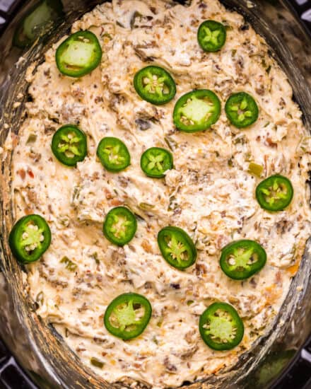 This easy game day appetizer combines the flavors of jalapeño poppers and spicy sausage in a creamy dip made in the slow cooker or oven. Perfect for any party, serve it up with chips and watch everyone go back for seconds!