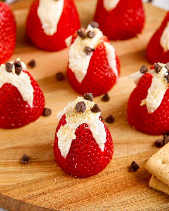 cheesecake stuffed strawberries sprinkled with graham cracker crumbs and chocolate chips