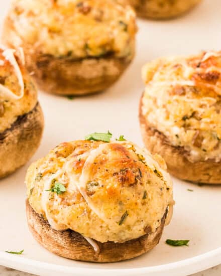 These Cream Cheese Stuffed Mushrooms are the ultimate party appetizer! Stuffed with a creamy vegetarian filling, then baked until deliciously golden, every bite is a flavor explosion. They can even be assembled and prepped ahead of time!