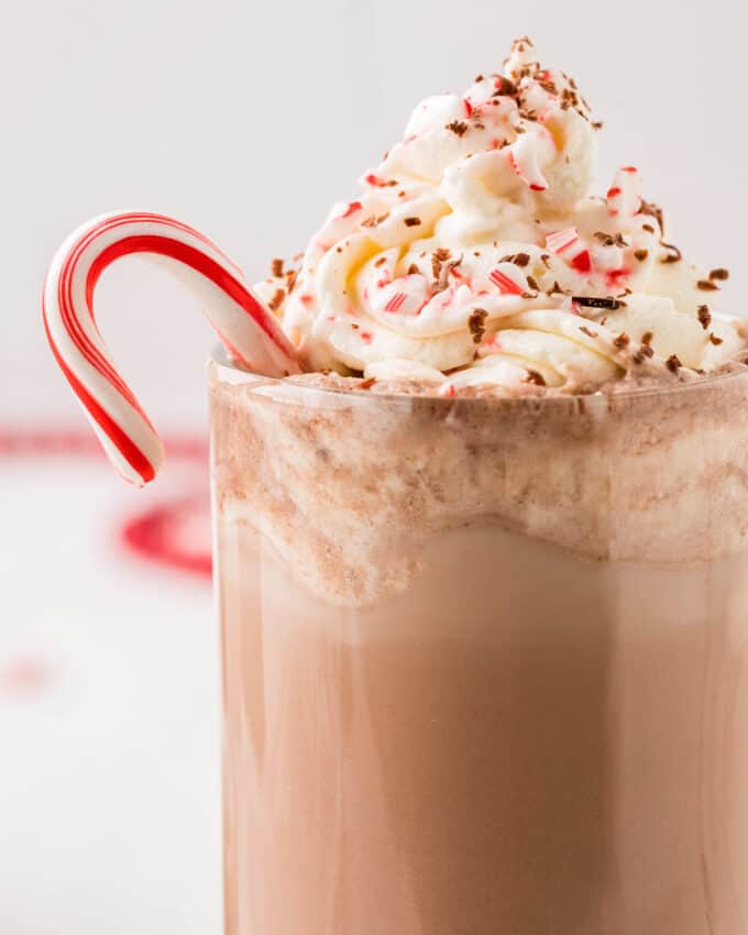 close up view of a peppermint mocha garnished with a candy cane