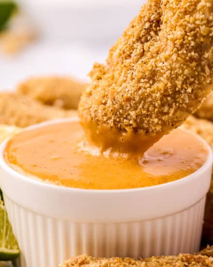 These chicken tenders are coated in an incredible cashew/coconut crust, and dipped in a simple, yet oh so delicious, fiery mango dipping sauce. Baked instead of fried, this easy chicken recipe is perfect for a weeknight meal!