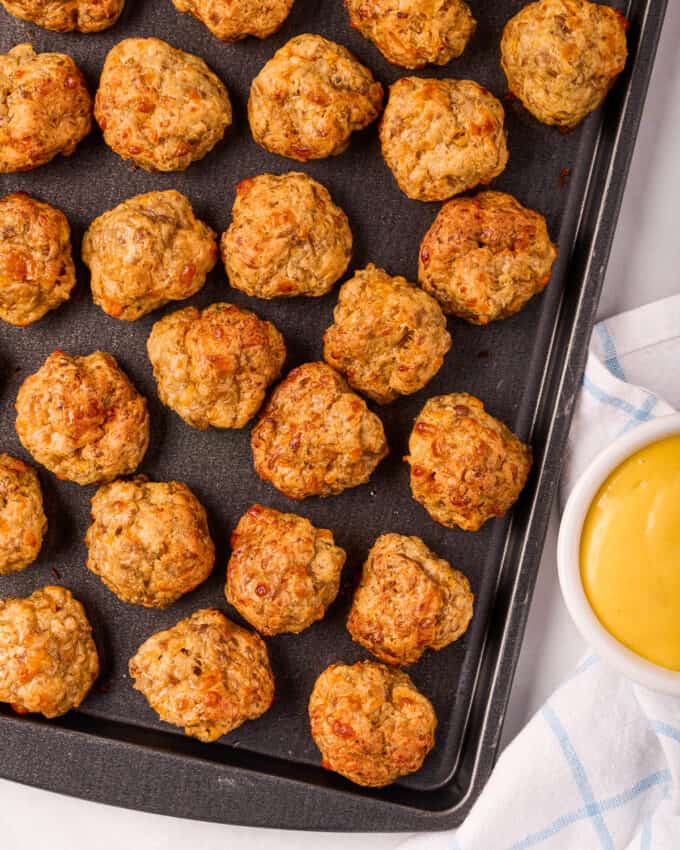 baked sausage cream cheese balls on baking sheet