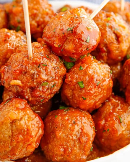 These Honey Buffalo Crockpot Meatballs are slow cooked in a mouthwatering sweet and spicy sauce made from just 4 ingredients! Perfect as a party appetizer, game day treat, or fun dinner!