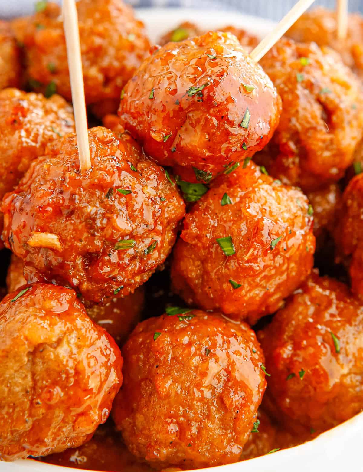 These Honey Buffalo Crockpot Meatballs are slow cooked in a mouthwatering sweet and spicy sauce made from just 4 ingredients! Perfect as a party appetizer, game day treat, or fun dinner!