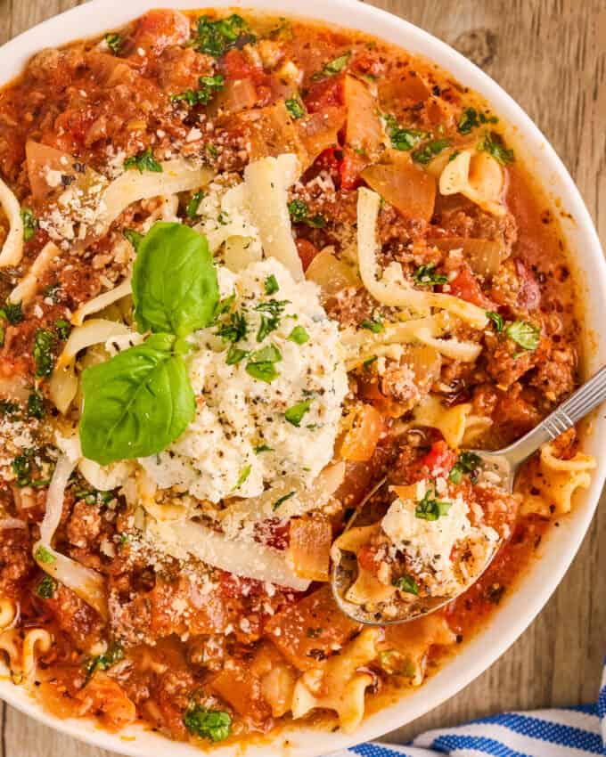 overhead photo of a white bowl filled with lasagna soup