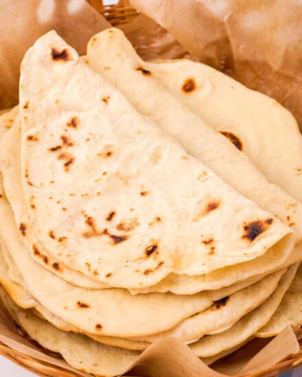 Soft, pliable, and sturdy, these Homemade Flour Tortillas are made from just 5 simple pantry ingredients (and no yeast - so no rising time!). So much better than store-bought, they're also make-ahead and freezer-friendly!