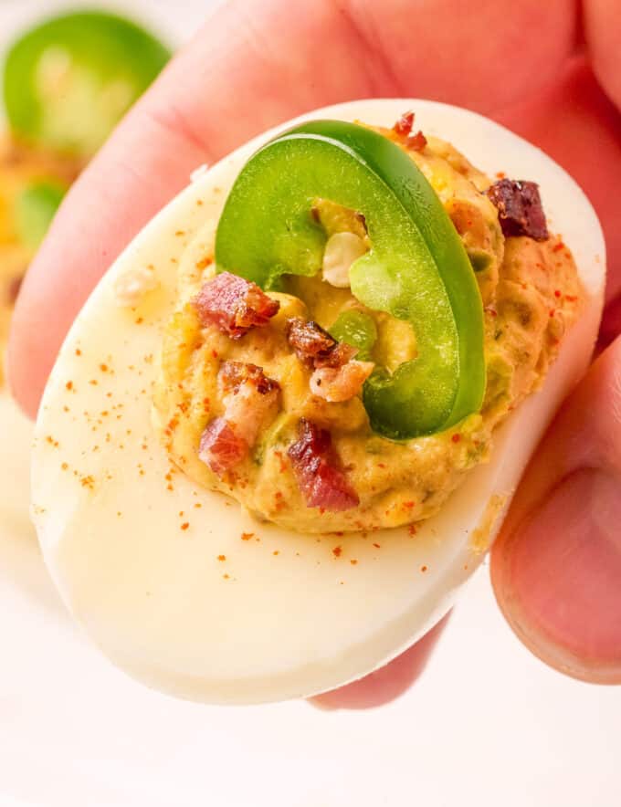 These Jalapeño Bacon Deviled Eggs are so creamy, with a spicy and savory flavor, and easy to make and even prep ahead. Perfect for a bbq, potluck, holidays, and more!