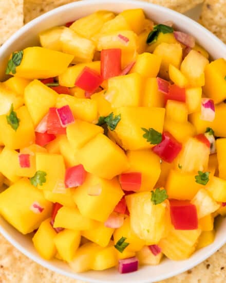 This fresh salsa is made with juicy ripe mangos, fresh pineapple, crunchy bell peppers, spicy fresno pepper, red onion and more! Mango salsa is the perfect accompaniment to your seafood, chicken, or pork tacos!