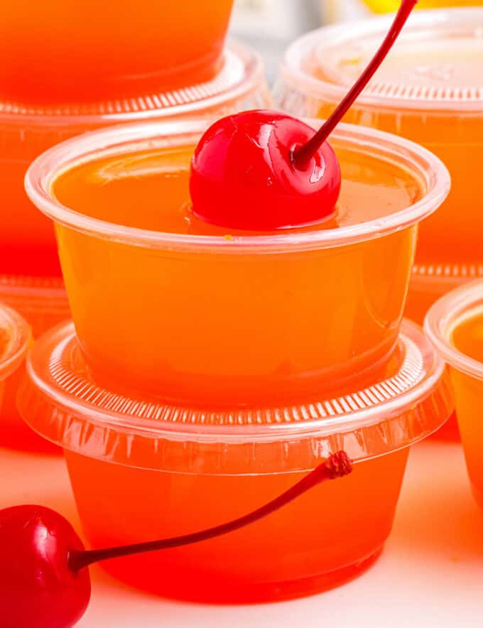 Sweet and fruity, these Tequila Sunrise Jello Shots are a fun way to enjoy a classic summer cocktail... in Jello shot form! Perfect for any summer party, you'll love how easy these are to make, with only 5 ingredients.