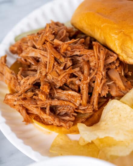 This instant pot pulled pork is succulent and tender, and goes perfectly with your favorite bbq sauce! Made with a savory and sweet spice rub, this pulled pork is perfect for a crowd, fantastic on a bun, and so much more.