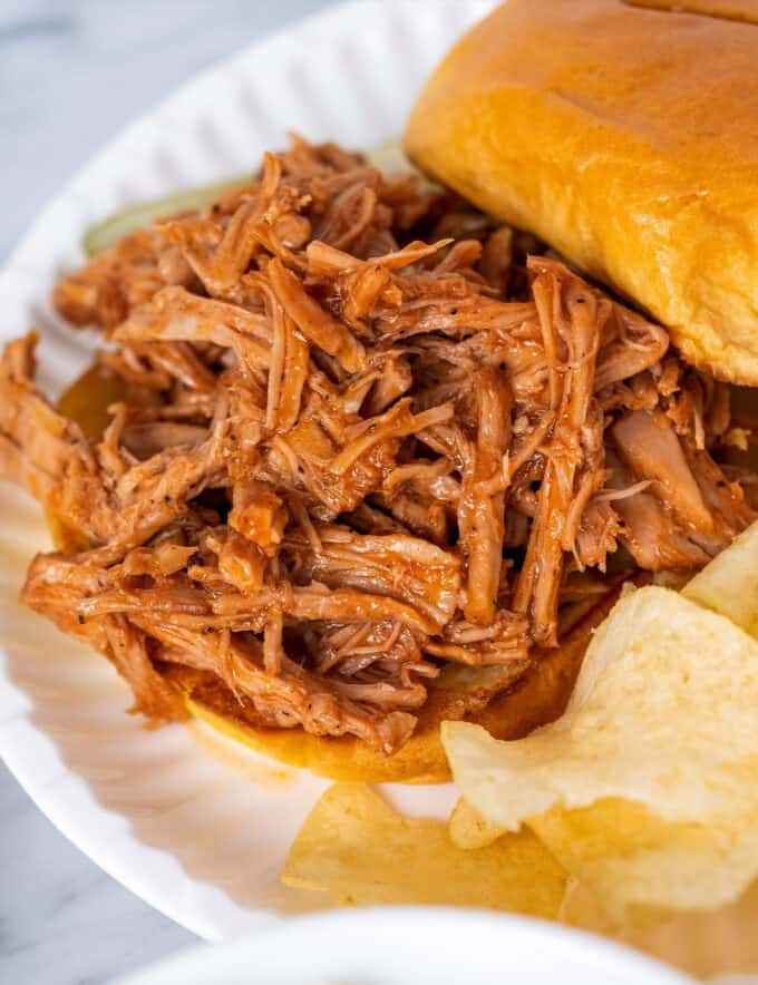 This instant pot pulled pork is succulent and tender, and goes perfectly with your favorite bbq sauce! Made with a savory and sweet spice rub, this pulled pork is perfect for a crowd, fantastic on a bun, and so much more.