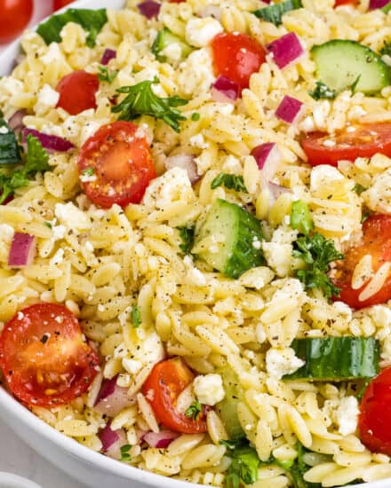 This light and easy to make lemon orzo salad is the perfect make-ahead pasta salad. Made with a tangy and slightly sweet lemon vinaigrette, this side dish is full of fresh produce like cucumbers and cherry tomatoes and packed with bold, yet simple flavors.