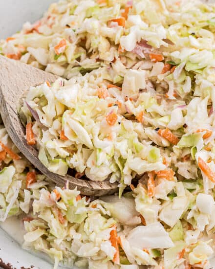 This simple Copycat KFC Coleslaw Recipe is made with crisp cabbage and carrots in a creamy, sweet and tangy buttermilk dressing! Perfect to make ahead, bring to a cookout as a side dish, or on top of a bbq sandwich!
