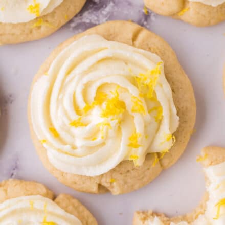 frosted lemon sugar cookies on a marble board.