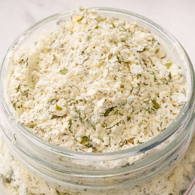 close up photo of buttermilk ranch seasoning mix in a glass mason jar.