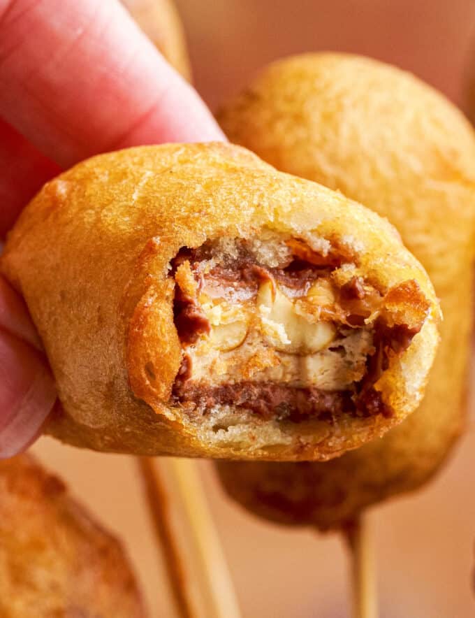 Deep-fried snickers are a classic American fair food, and they're easy to make at home. Just grab 5 simple ingredients, and you'll be on your way to a deliciously gooey treat!