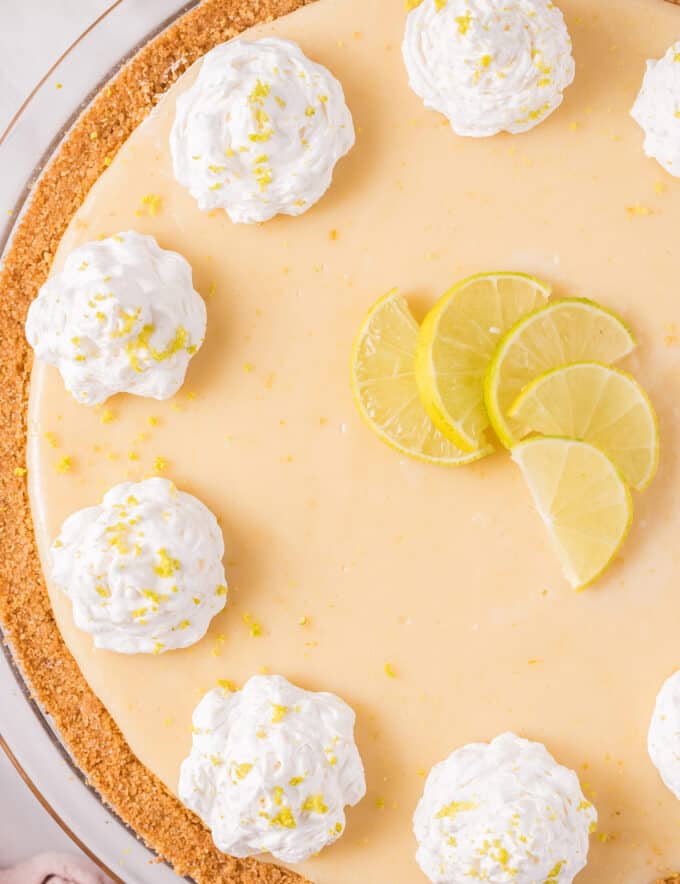 Key lime pie is the perfect blend of sweet and tart! Made with a cool and refreshing creamy key lime filling inside a buttery graham cracker crust, this dessert is incredibly easy and fun to make.