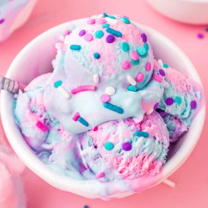 bowl of no churn ice cream (cotton candy flavor), with a spoon.