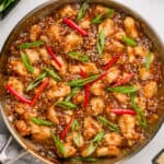 overhead view of black pepper chicken stir fry in skillet.