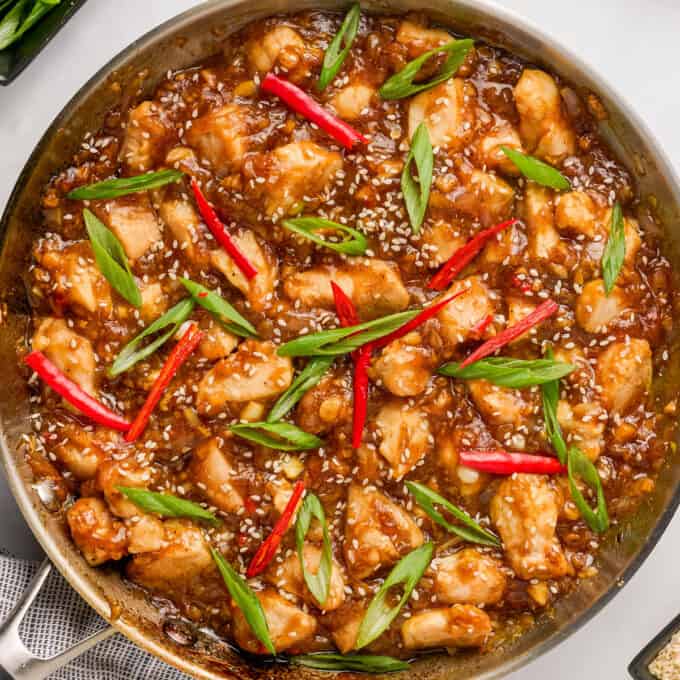 overhead view of black pepper chicken stir fry in skillet.