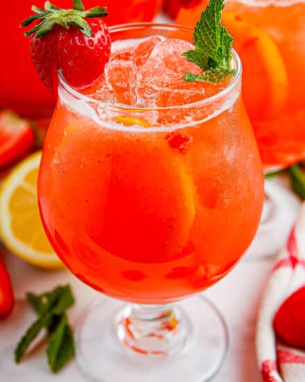 Cool down with the ultimate summer drink… strawberry lemonade!  Homemade simple syrup combined with pureed ripe strawberries and mixed with refreshing homemade lemonade. This refreshing drink is made with only 4 ingredients (including water), and it's a great way to use up ripe berries!