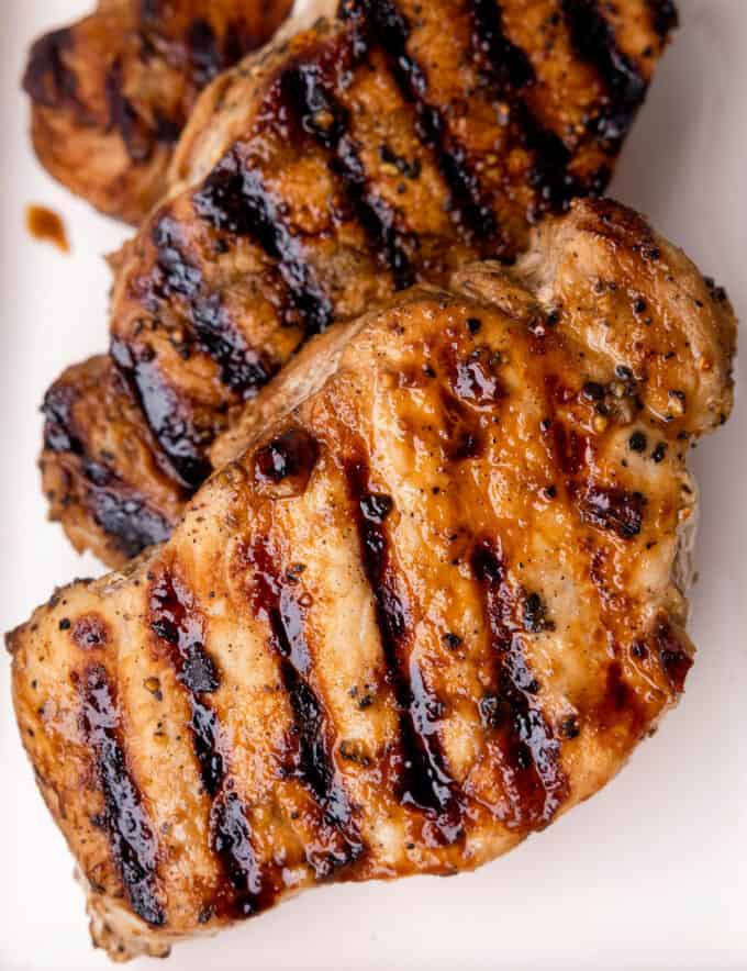 Pork chops are marinated in a simple marinade made with honey mustard, soy sauce, and garlic, then grilled until perfectly juicy and tender with some great char! Perfect for a family dinner, meal prep, and more!