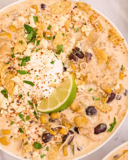 This chicken and street corn chowder combines the comfort of chicken chili and corn chowder with the bold flavors of Mexican street corn (elote). They combine in a mouthwateringly delicious bowl of soup that can be made in the slow cooker, instant pot, or on the stovetop!