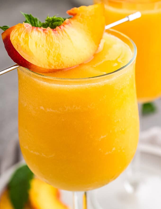 Beat the heat with a refreshing Frozen Peach Bellini, a delightful twist on a classic cocktail. This simple recipe uses just 3 ingredients to combine the natural sweetness of frozen peaches with sparkling wine, creating a frosty treat that feels like a tropical paradise.
