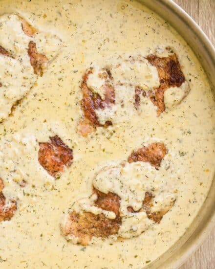 Juicy and tender pork chops are seared, then smothered in a gloriously creamy and insanely flavorful garlic ranch sauce! Perfect over mashed potatoes or rice, this one pan dinner is ready in about 30 minutes and sure to "wow" the entire family!