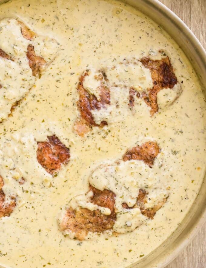 Juicy and tender pork chops are seared, then smothered in a gloriously creamy and insanely flavorful garlic ranch sauce! Perfect over mashed potatoes or rice, this one pan dinner is ready in about 30 minutes and sure to "wow" the entire family!