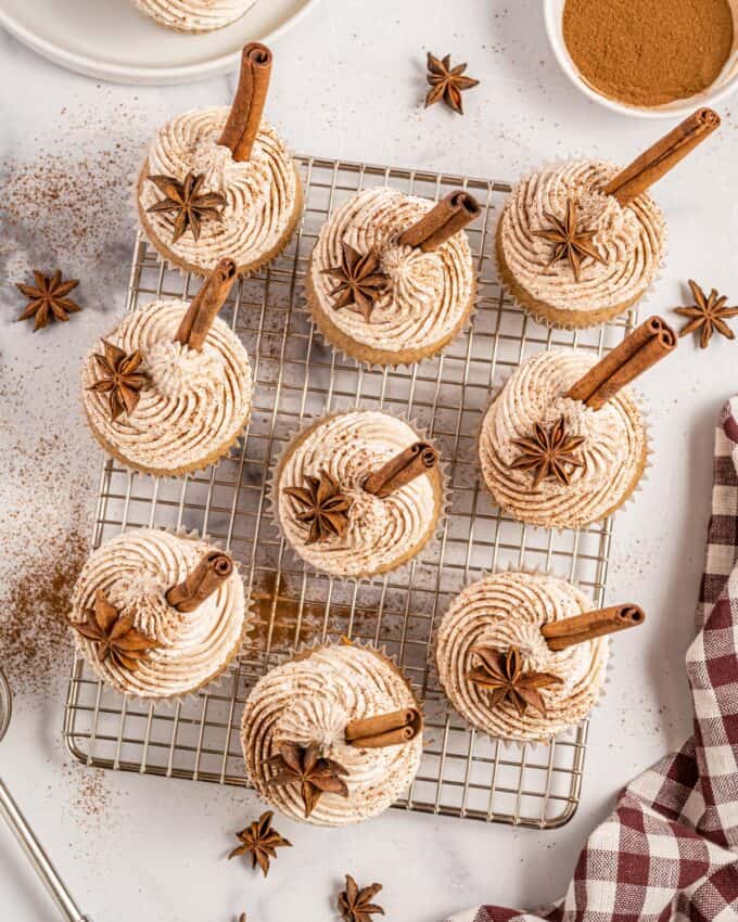 chai latte cupcakes on a wire cooling rack.