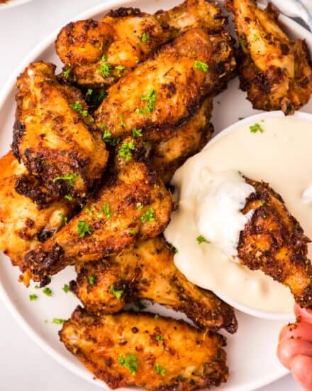 The best chicken wings are tender, juicy, and perfectly crispy! That's exactly what you get when you cook wings in an air fryer. This recipe uses a simple dry rub to add bold flavors, and a cooking method that yields some of the best wings you'll have!
