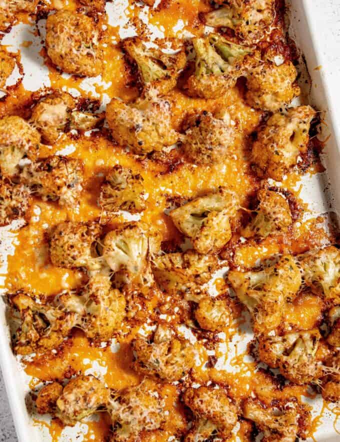 This Parmesan Roasted Cauliflower is the perfect side dish that pairs well with just about any protein! The spiced florets are tender with perfectly caramelized edges, and blanketed in crisp and savory melted Parmesan cheese, and the whole thing is ready in about 30 minutes.