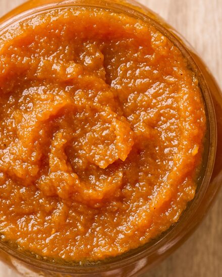 This homemade spiced pumpkin butter is velvety, rich, and tastes like a spread-able version of pumpkin pie! Made with canned pumpkin for convenience, it's great on breads, pastries, used in baking, or just eaten with a spoon!