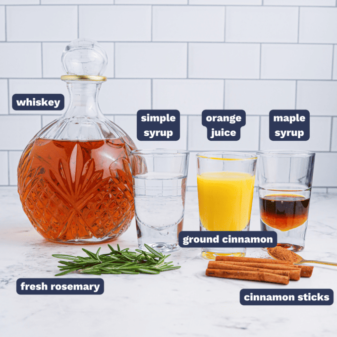 ingredients needed to make a cinnamon maple whiskey sour cocktail.