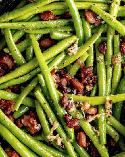 Simple and easy, these garlic green beans with bacon and Parmesan cheese are made using fresh green beans that are cooked until crisp tender, and seasoned with bold flavors! They’re the perfect side dish that even the kids will love!