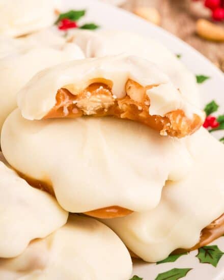 These polar bear paw candies are caramel nut clusters (made with peanut and cashews) that are coated in a blanket of creamy white chocolate. They're perfect for the holiday season since they're no-bake, easy, and taste amazing!