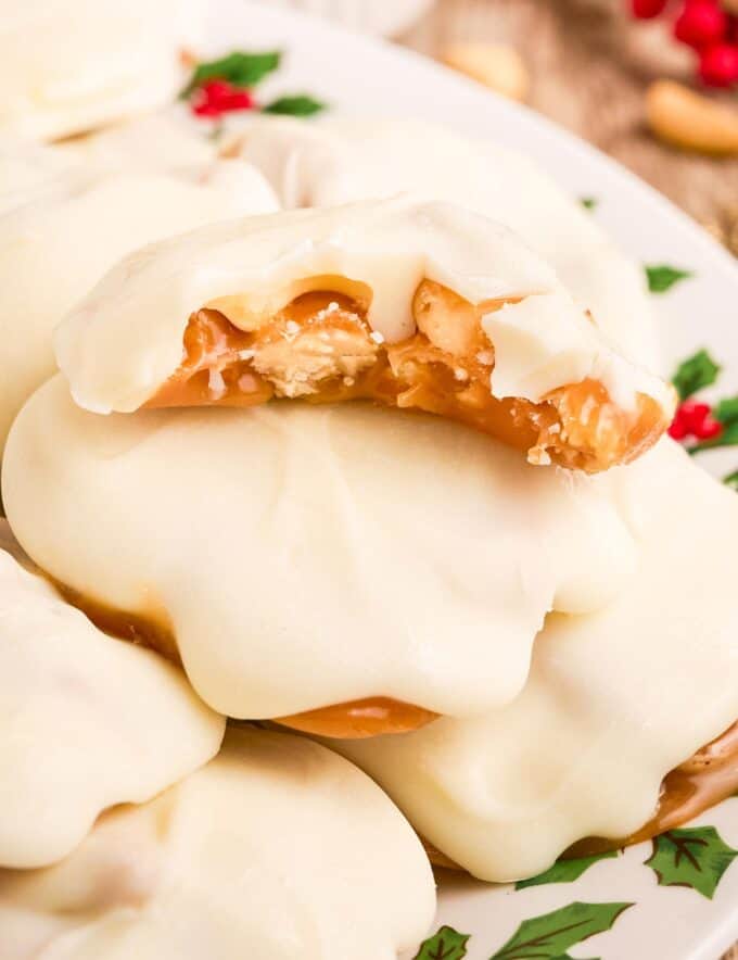 These polar bear paw candies are caramel nut clusters (made with peanut and cashews) that are coated in a blanket of creamy white chocolate. They're perfect for the holiday season since they're no-bake, easy, and taste amazing!