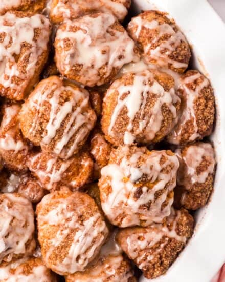 Monkey bread is a family-favorite sweet breakfast treat that's so easy to make! This version uses canned biscuit dough (nice and simple!) that's rolled in cinnamon sugar and baked until gooey and browned. Topped with a classic sweet glaze, each bite tastes like the center part of a cinnamon roll!