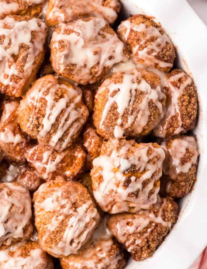 Monkey bread is a family-favorite sweet breakfast treat that's so easy to make! This version uses canned biscuit dough (nice and simple!) that's rolled in cinnamon sugar and baked until gooey and browned. Topped with a classic sweet glaze, each bite tastes like the center part of a cinnamon roll!