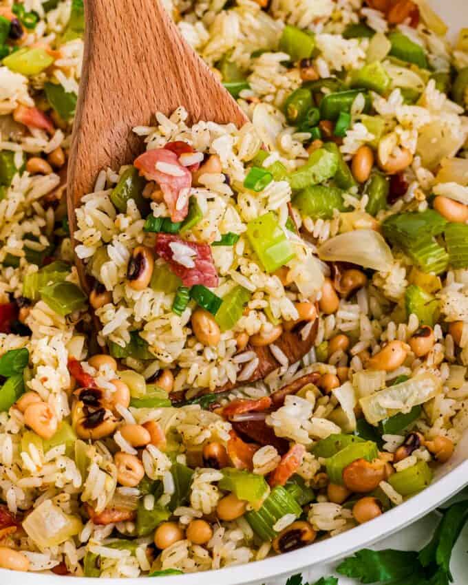 wooden spoon full of carolina peas and rice