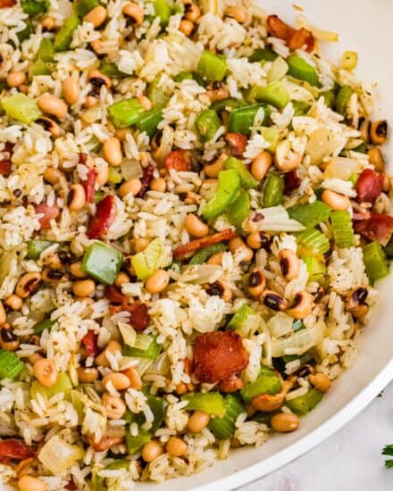 This Southern comfort food is typically eaten on New Year's Day for good luck, but I think it's delicious all year round! Made with black-eyed peas, veggies, bacon, white rice, and a blend of savory spices, this recipe is hearty enough for a main dish, but also works great as a side!