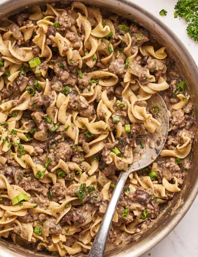 Beef stroganoff is one of the most soul-warming comfort foods around!  This version uses more economical ground beef instead of steak, and is full of mushrooms and onions that are smothered in a rich, beefy gravy and tossed with egg noodles.  Ready in about 30 minutes, it’s a fabulous weeknight dinner option! 