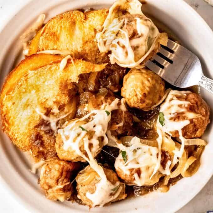 bowl filled with french onion meatballs and french bread
