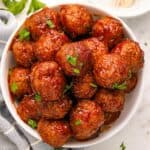 overhead photo of raspberry balsamic crockpot meatballs in a bowl.