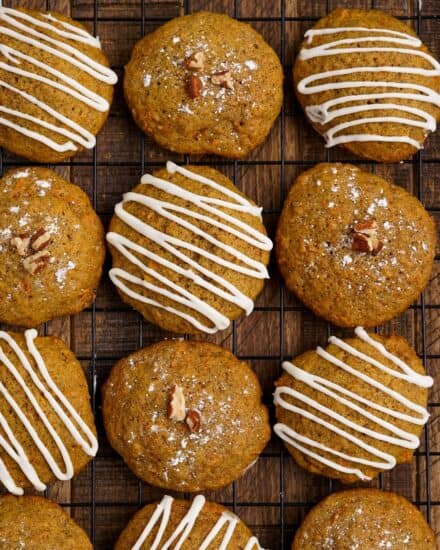 These soft and tender carrot cake cookies are perfect with just a dusting of powdered sugar, or a decadent drizzle of cream cheese frosting! They're so moist and the perfect Easter or Spring dessert!