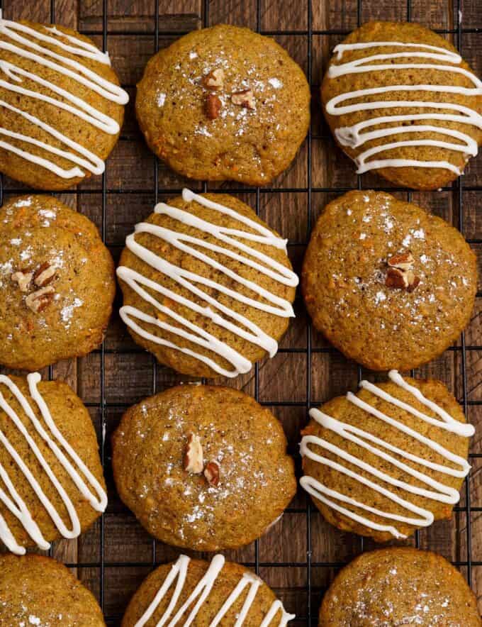 These soft and tender carrot cake cookies are perfect with just a dusting of powdered sugar, or a decadent drizzle of cream cheese frosting! They're so moist and the perfect Easter or Spring dessert!