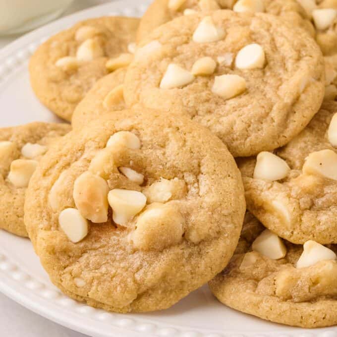 pile of macadamia nut cookies on a plate.